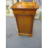 An reproduction mahogany pot cupboard with single drawer having a shield shaped lock and key