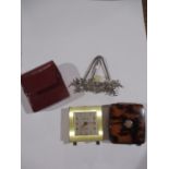 A silver miniature easel with a Scottish theme with a central thistle in amber glass, together