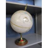 A Replogle 12" diameter World Classic series globe in cream on a brass and treen stand