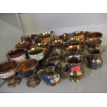 A collection of 19th and 20th century copper lustre ware jugs and goblets