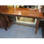 An early 20th century mahogany side table on castors 70 x 107 x 49