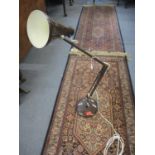 A mid 20th century dark brown anglepoise lamp