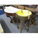 An oak framed wash stand with cross banded and barley twist supports having a later yellow china