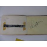 An autograph book with various signatures