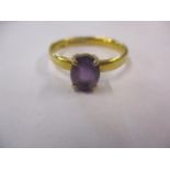 A 22ct gold and amethyst dress ring 3.9grams total weight, ring size UK letter U