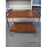 A 1970's rosewood two tier and chrome tea trolley