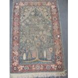 A Persian silk scatter rug with Tree of Life design, having a floral border and tassels, 59 x 100cm