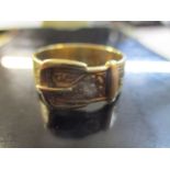 A 9ct yellow gold belt and buckle ring with engraved decoration, approximately 5.48g
