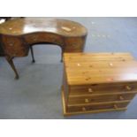 A 1920's walnut kidney shaped desk (top A/F) together with a modern pine chest of three long drawers