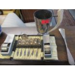 A group of silver and silver plated items to include two cased napkin rings and a cased set of