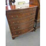 A reproduction mahogany bow fronted chest of four graduated drawers