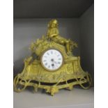 A late 19th century gilt spelter mantle clock surmounted by a child and a sheep