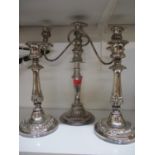 A pair of silver plated candlesticks A/F and a silver plated candelabra