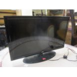 A JVC 31" flat-screen tv on stand, no remote