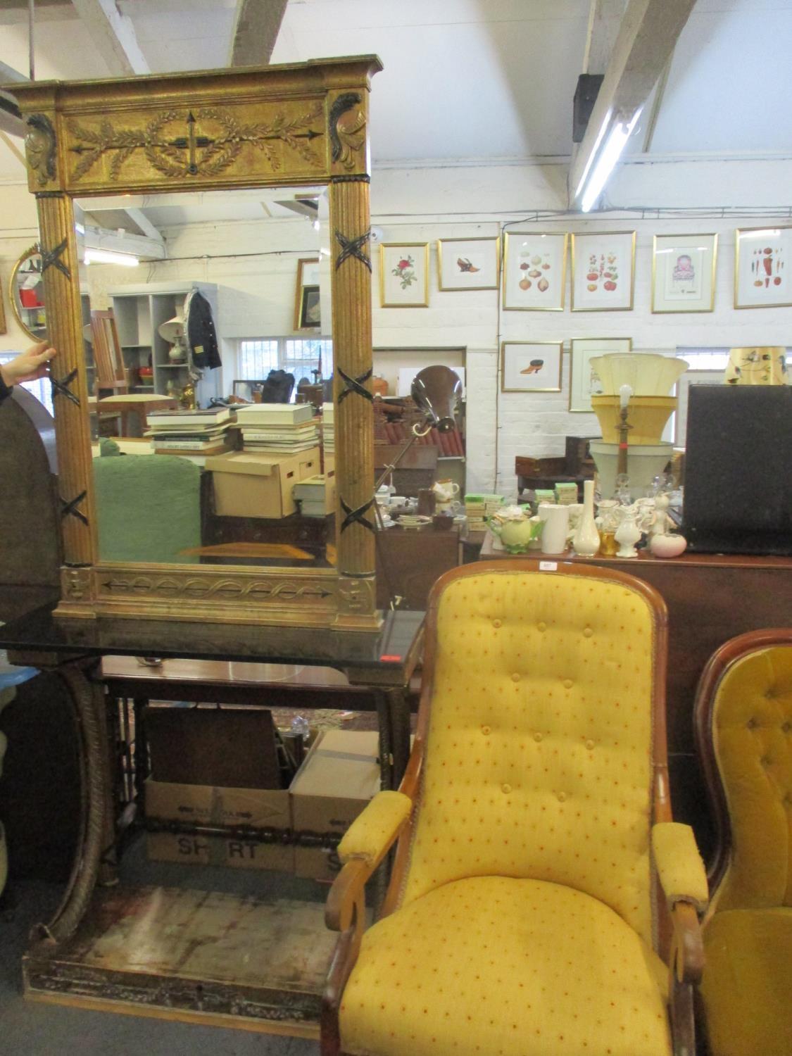 A gilt and black painted console table and matching Empire style mirror above a black marble