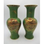 A pair of 1930s Carlton Ware 'Dragon and cloud' pattern vases, of baluster shape, with matte green
