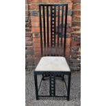 An Arts and Crafts style dining chair after Charles Rennie Mackintosh, in the 'Hill House' style,