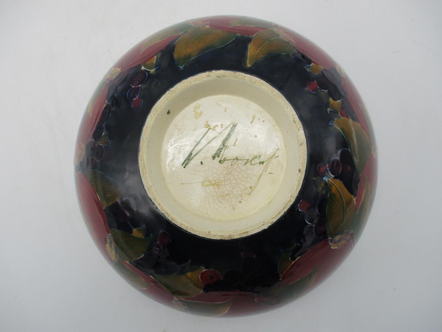 A large William Moorcroft bowl in the pomegranate pattern, raised on a small circular base, with - Image 3 of 8