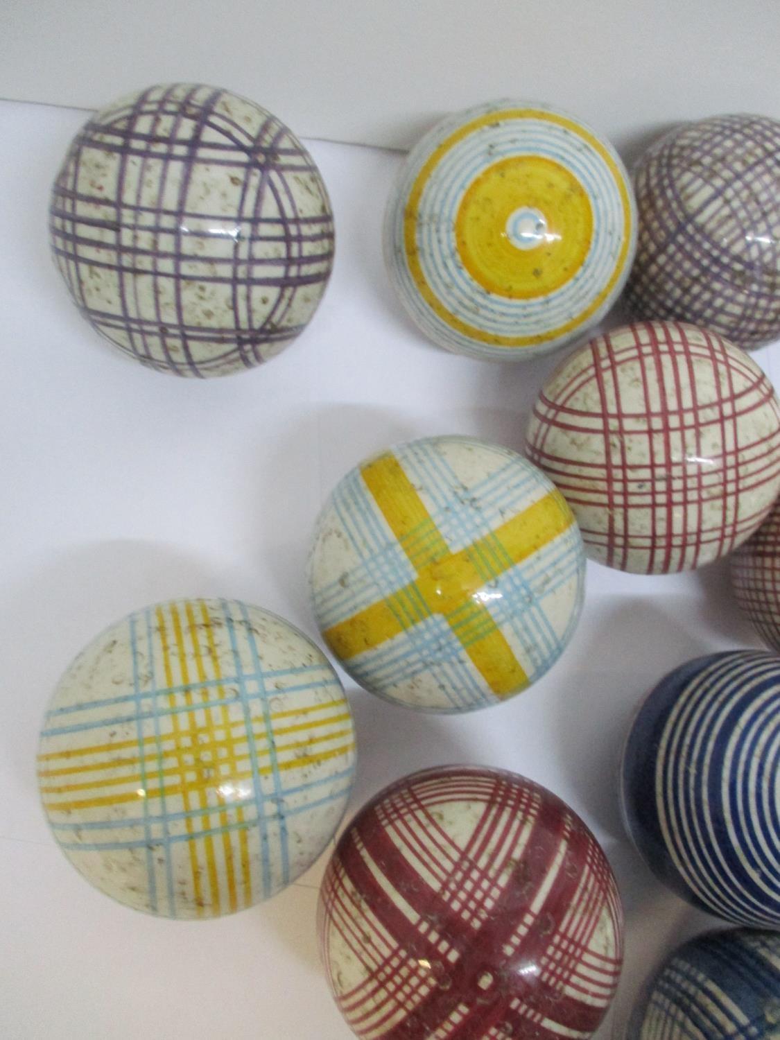 A group of thirteen Victorian Scottish ceramic carpet bowls, with colourful tartan and striped - Image 3 of 4