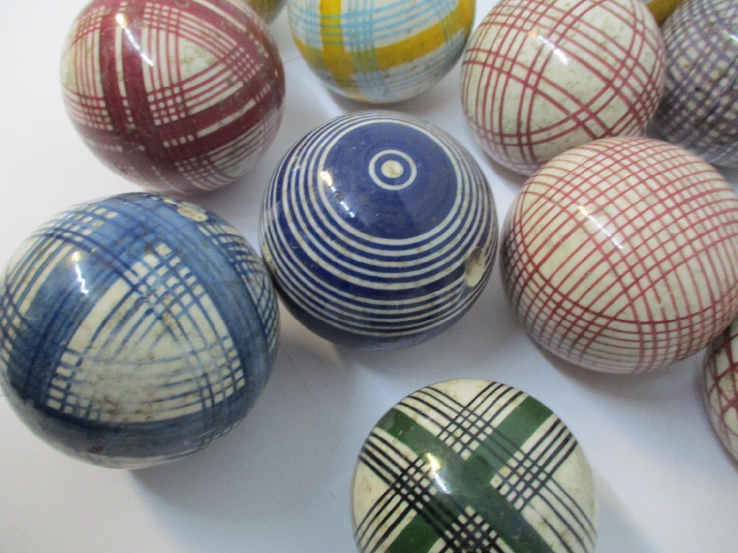 A group of thirteen Victorian Scottish ceramic carpet bowls, with colourful tartan and striped - Image 2 of 4