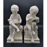 A pair of late 19th century parian ware cherubs, probably by Minton, each modelled studying and