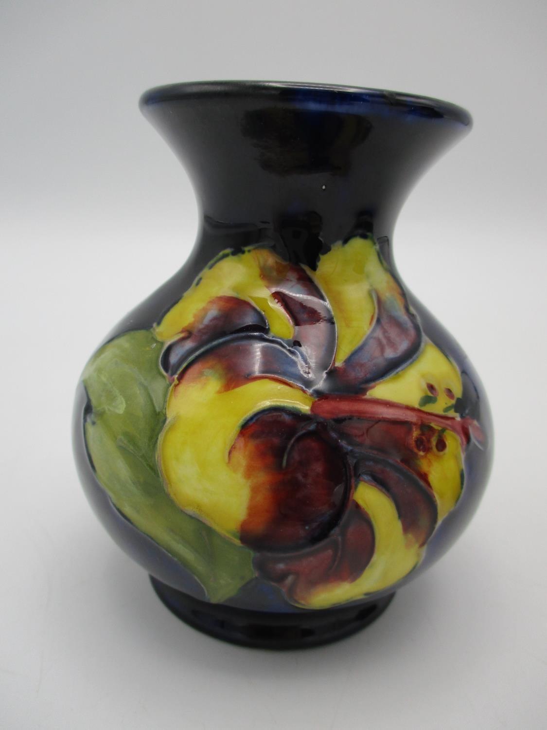 A Moorcroft squat baluster vase in the Hibiscus pattern, on deep blue ground, with impressed mark to - Image 2 of 6