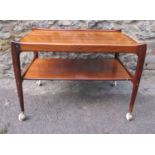 A mid century Modern Design hardwood tea trolley, of Danish style, with rounded edges on tapered