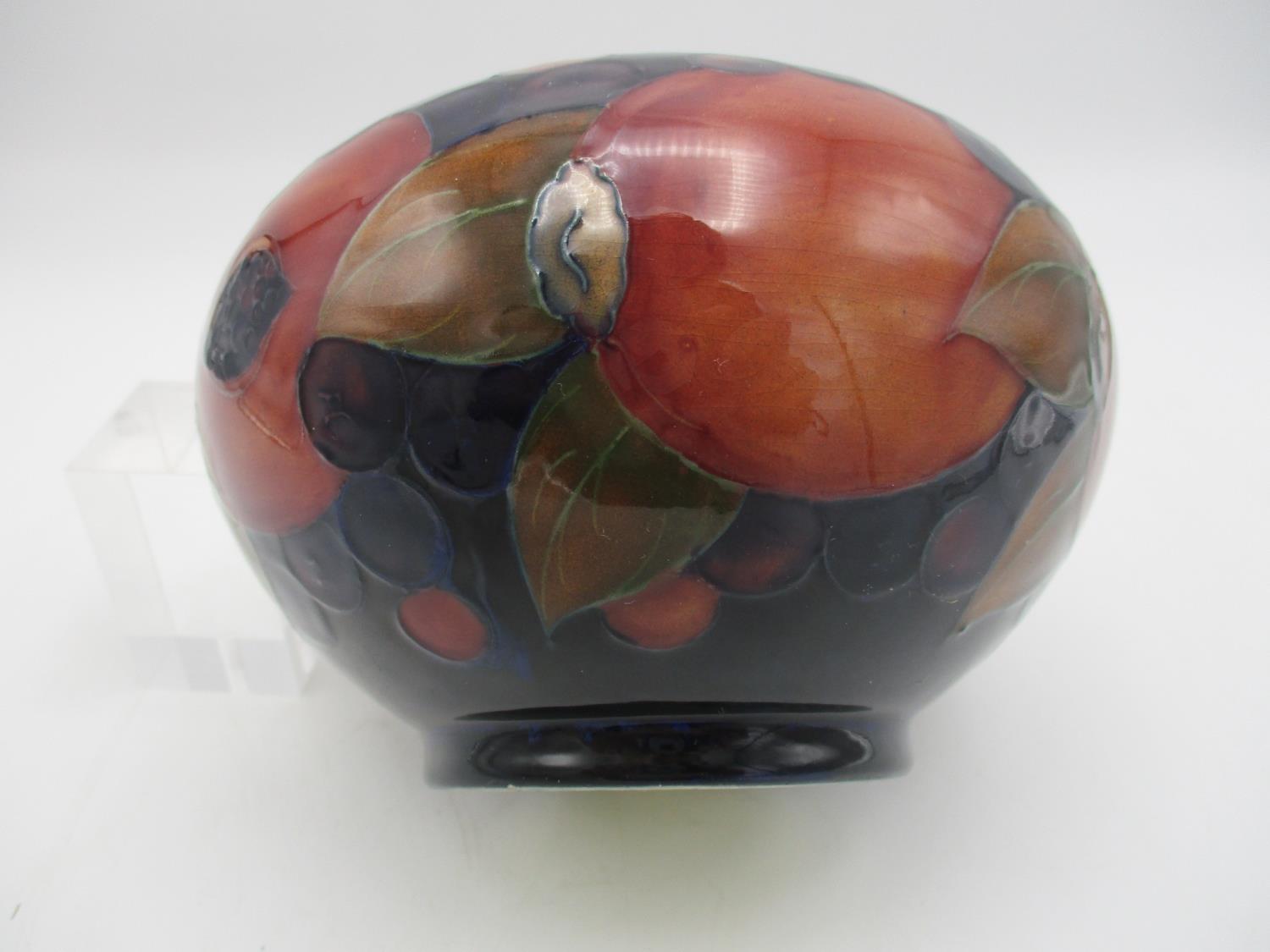 A Walter Moorcroft bowl in the pomegranate pattern, on deep blue ground, of bulbous shape with - Image 2 of 3