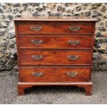 A George III mahogany chest of four graduated long drawers with later brass handles, on bracket feet