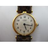 A Cartier Vermeil silver gilt quartz ladies quartz modern wristwatch having a silvered dial with