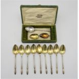 A set of nine late 19th century French silver and vermeil teaspoons by Henin & Cie, designed in