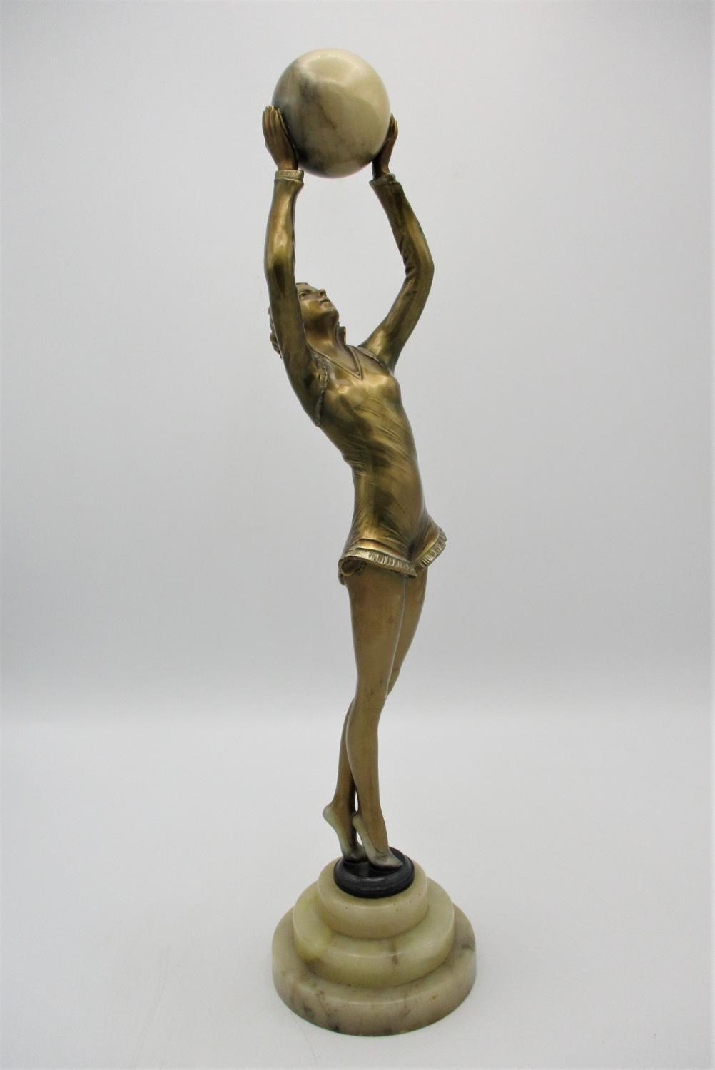 After Josef Lorenzl (1892-1950) 'Ball Girl', an Art Deco gilt spelter model of a dancer holding an