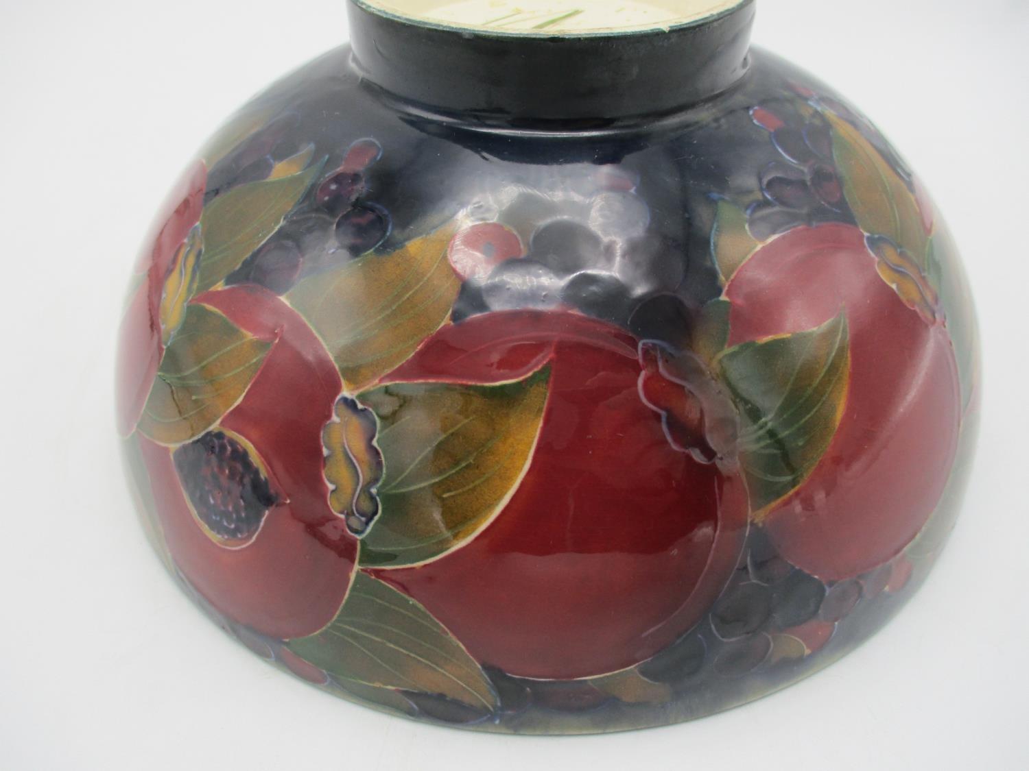 A large William Moorcroft bowl in the pomegranate pattern, raised on a small circular base, with - Image 4 of 8