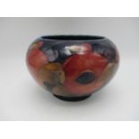 A Walter Moorcroft bowl in the pomegranate pattern, on deep blue ground, of bulbous shape with