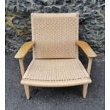 A Carl Hansen & Son CH25 Lounge Chair, designed by Hans J. Wegner, made with oak frame and woven