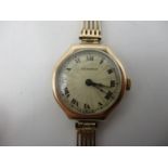 An early 20th century Burnex 9ct gold ladies manual wind wristwatch on a 15ct gold bracelet. The