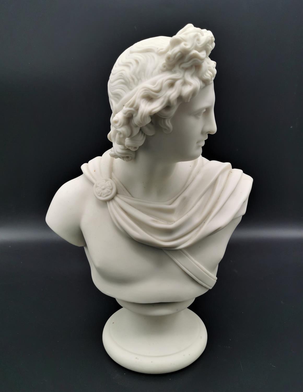 A turn of the century parian ware bust of Apollo after C. Delpech, possibly by Copeland, on a