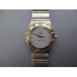 A Omega Constellation steel and 18ct gold ladies quartz wristwatch having a mother of pearl dial