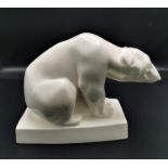 A 1920s Wedgwood cream glazed ceramic polar bear designed by John Skeaping, raised on a