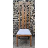 An Arts and Crafts oak dining chair in the Ingram style after Charles Rennie Mackintosh, with tall
