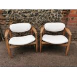 A pair of mid century Danish designer lounge chairs, in the manner of Finn Juhl or Arne Vodder, with