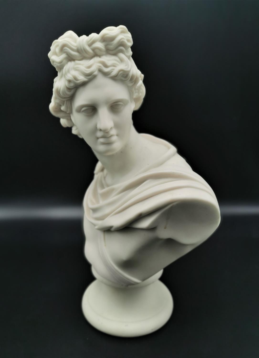 A turn of the century parian ware bust of Apollo after C. Delpech, possibly by Copeland, on a - Image 2 of 4