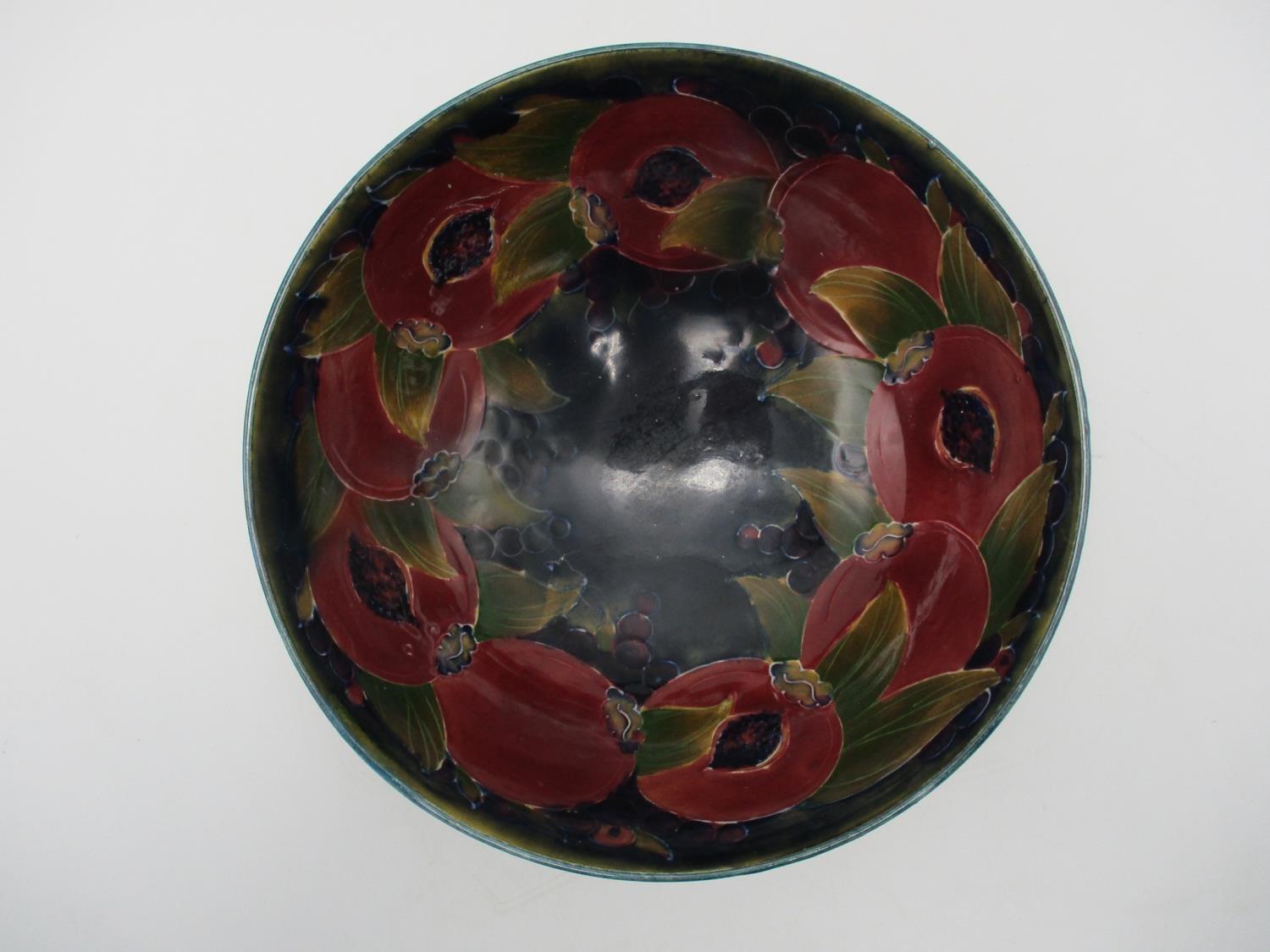 A large William Moorcroft bowl in the pomegranate pattern, raised on a small circular base, with - Image 2 of 8