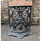 A fine Victorian cast iron corner umbrella stand, with cast leaf and floral scroll decoration