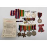 A group of seven WWII and later medals comprising the 1939-1945 star, the Africa star, Defence