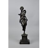 A 19th century Continental patinated bronze of a dancing maiden or bacchante dancing in a flowing