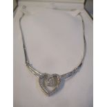 An earnest Jones silver diamond inset heart shaped necklace, boxed