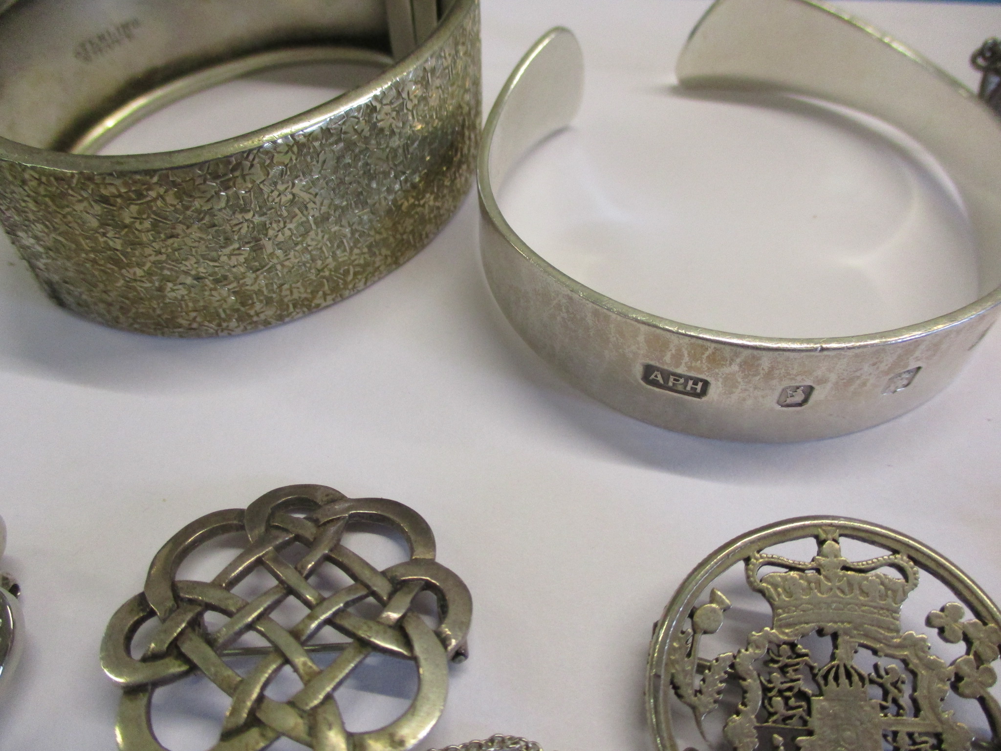 A silver fob watch chain, a silver ingot pendant on a white metal chain, two silver bangles and - Image 3 of 6