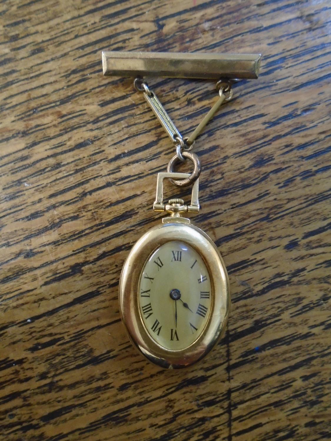 An 18ct gold cased Swiss lever pendant watch, 15 jewel movement, the case with angular binged top