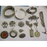 A silver fob watch chain, a silver ingot pendant on a white metal chain, two silver bangles and